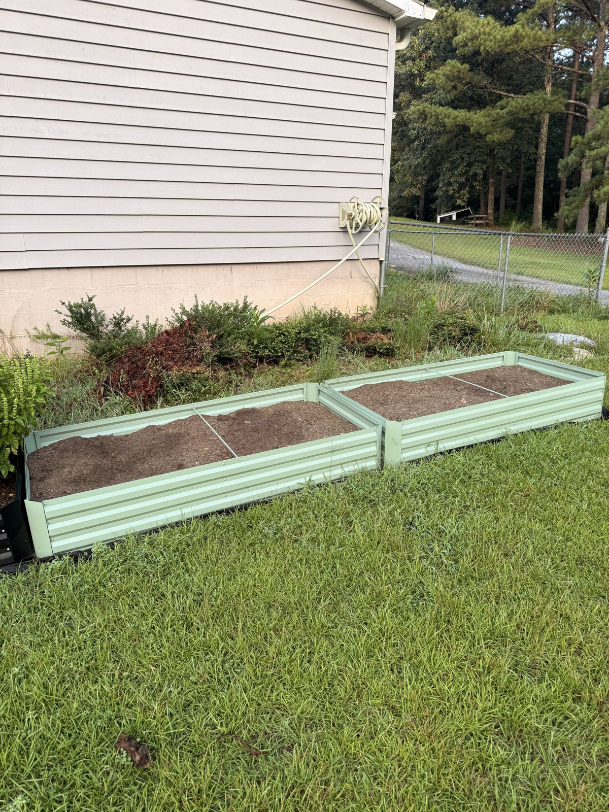 New raised garden beds being prepared for planting